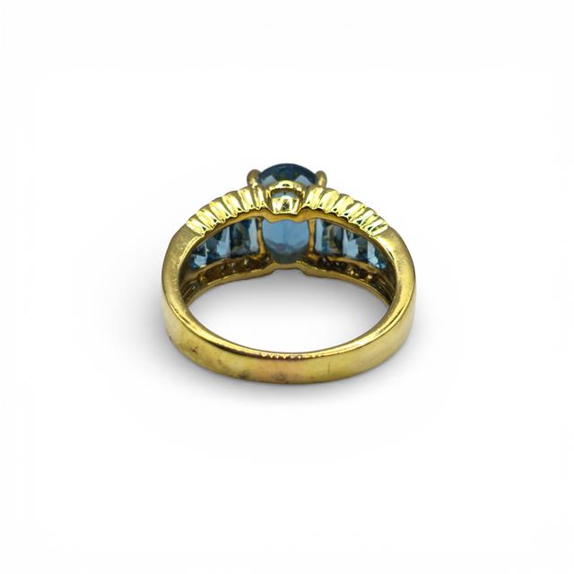 18ct yellow gold diamond and topaz ring featuring sparkling stones and elegant design, perfect for special occasions