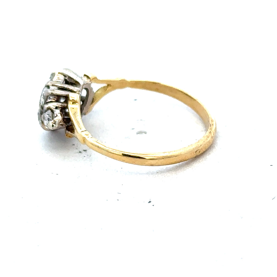 18ct yellow gold diamond cluster ring featuring a sparkling central design and intricate band detailing.