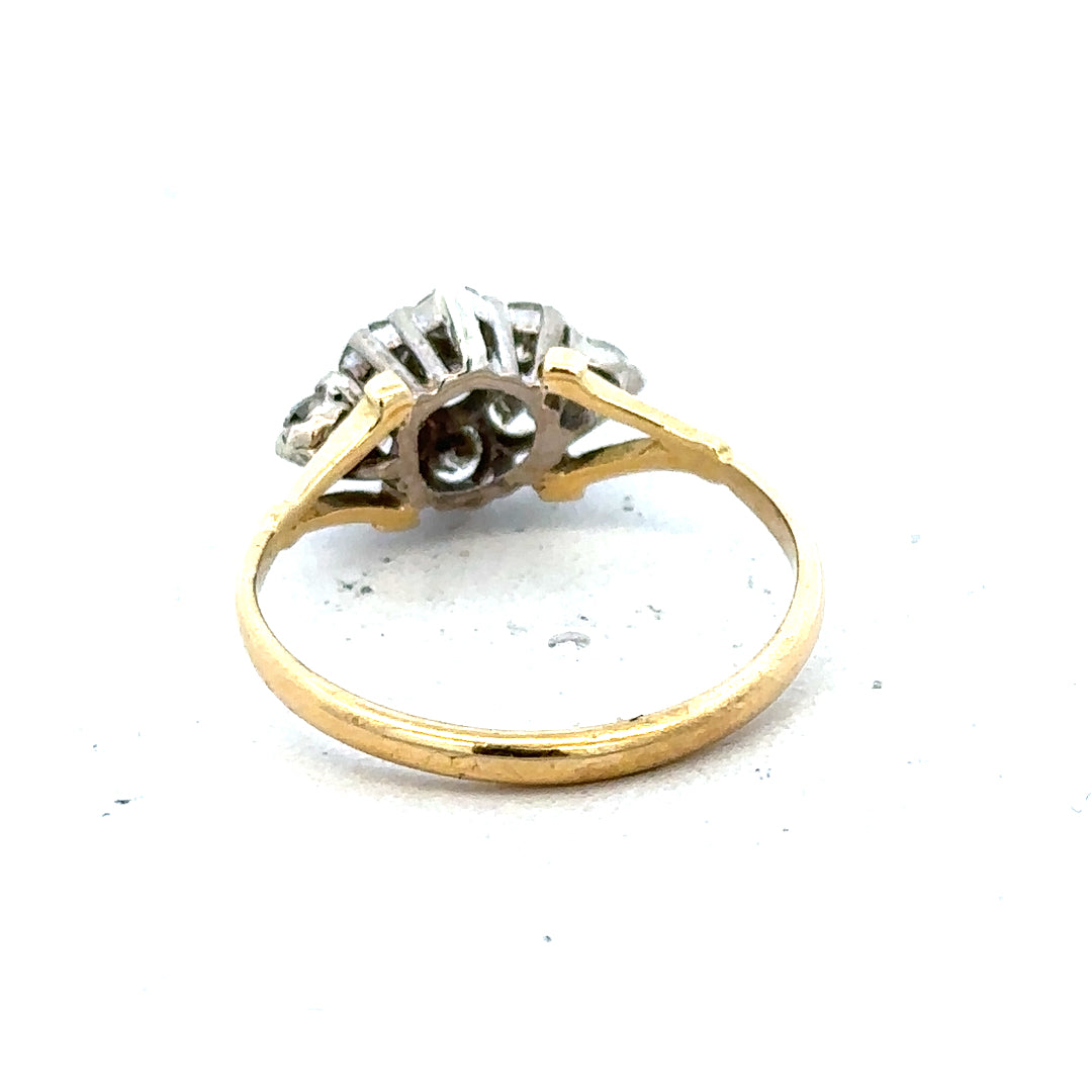 18ct yellow gold diamond cluster ring with sparkling stones set in a detailed design.