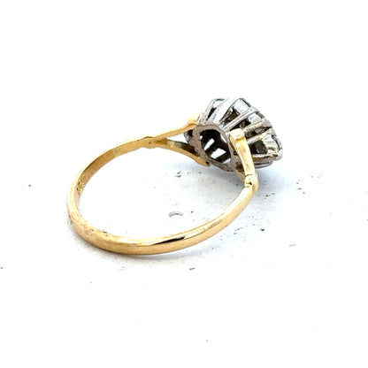 18ct yellow gold diamond cluster ring with sparkling diamonds set in a stylish gold band.