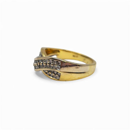 18ct yellow gold diamond crossover ring with sparkling diamonds, showcasing a stylish and elegant jewelry design.