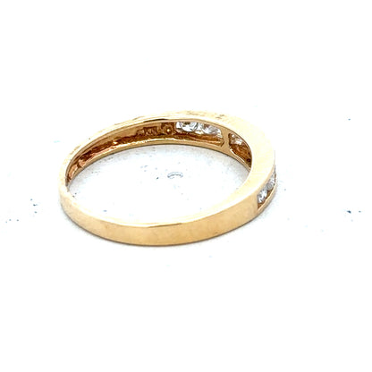 18ct yellow gold diamond half eternity ring with a continuous row of sparkling diamonds around the band.