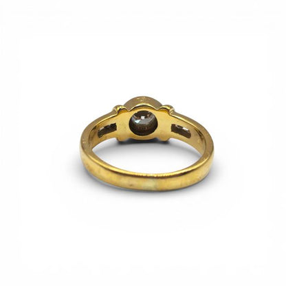 18ct yellow gold diamond ring with sparkling diamonds, featuring a sleek and elegant design.