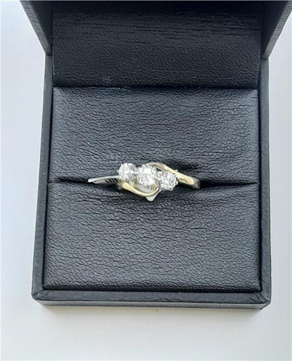 18ct yellow gold diamond ring in size J with 2.4g weight, featuring sparkling diamonds and a classic design.