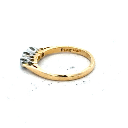 18ct yellow gold diamond ring in size J with a sleek design, weighing 2.5g, showcasing sparkling diamonds on a polished band.