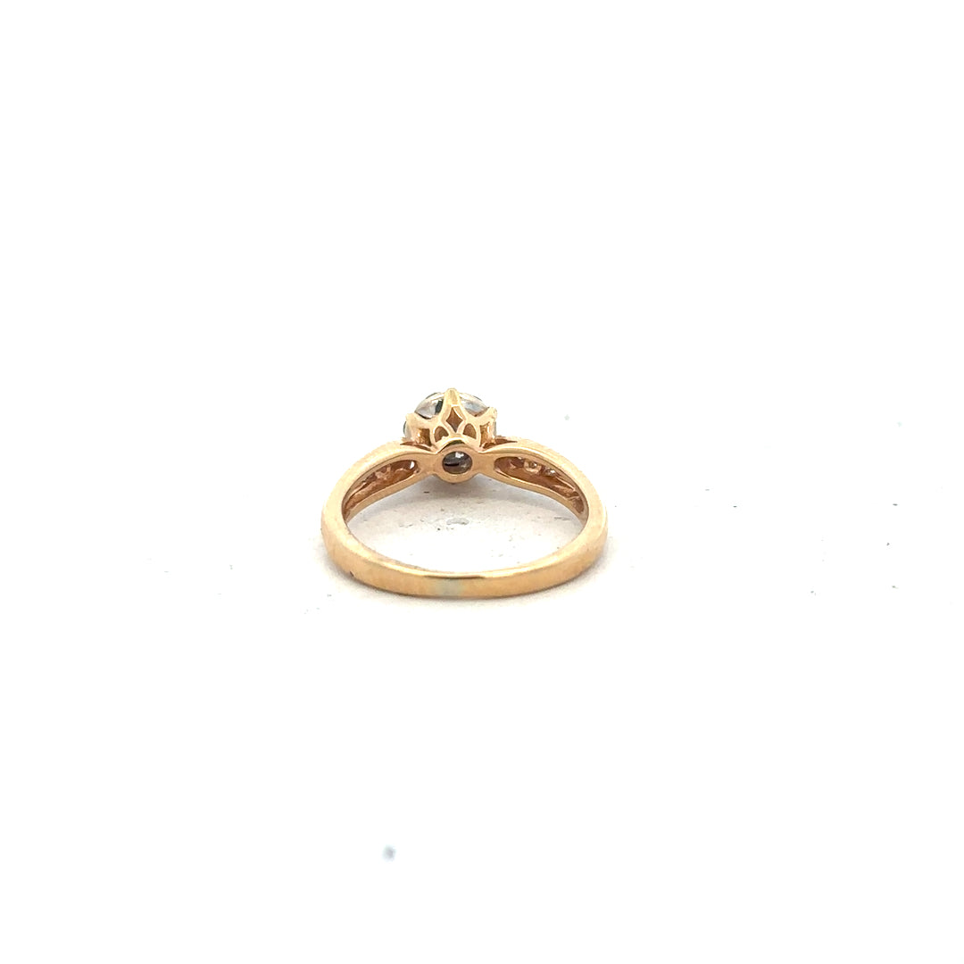 18ct yellow gold diamond ring in size J with sparkling diamonds, showcasing elegant craftsmanship and a sleek band design.