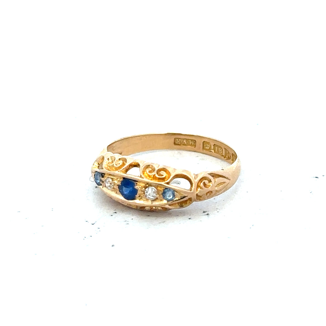 18ct yellow gold diamond ring in size J, featuring a sparkling central diamond and elegant band design.