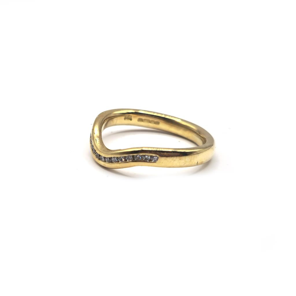 18ct yellow gold diamond ring in size K with sparkling diamonds, unbranded jewelry piece.