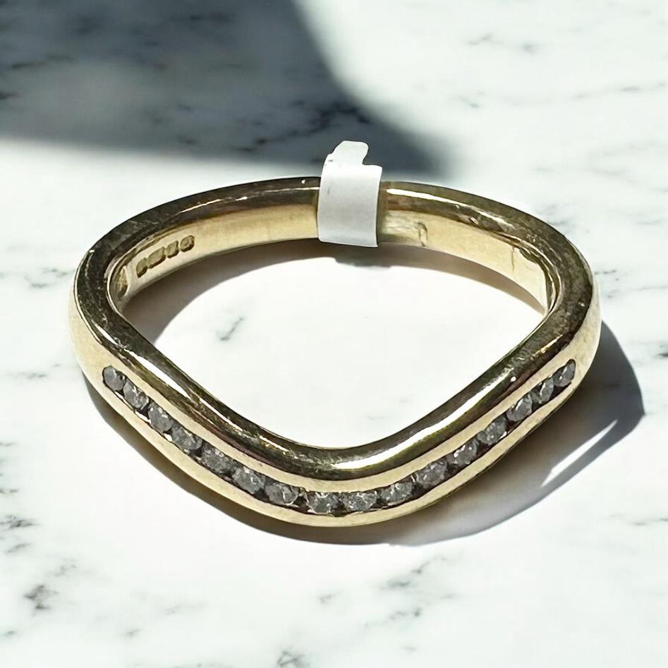 18ct yellow gold diamond ring in size K with sparkling diamonds, unbranded jewelry design, elegant and luxurious appearance