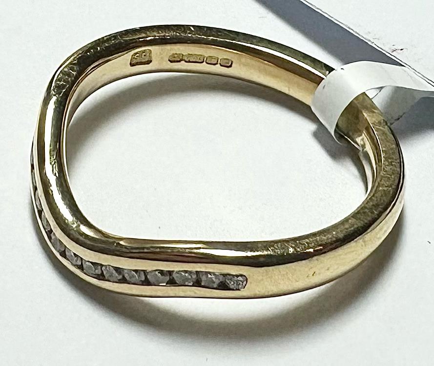 18ct yellow gold diamond ring in size K with a sparkling diamond setting, unbranded jewelry piece.