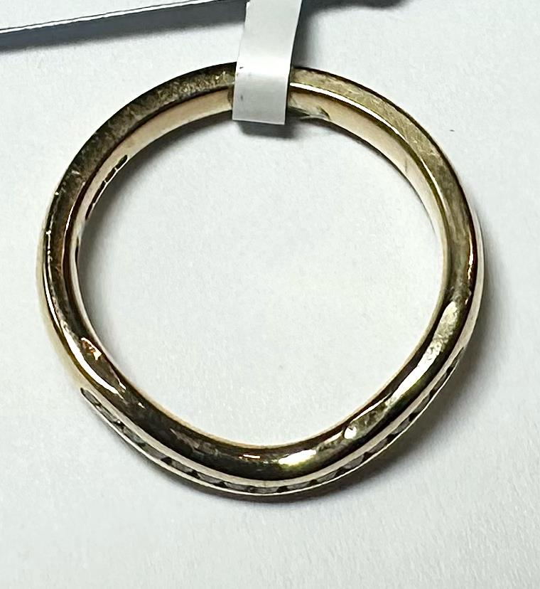18ct yellow gold diamond ring in size K with sparkling diamonds, featuring a sleek, elegant design.
