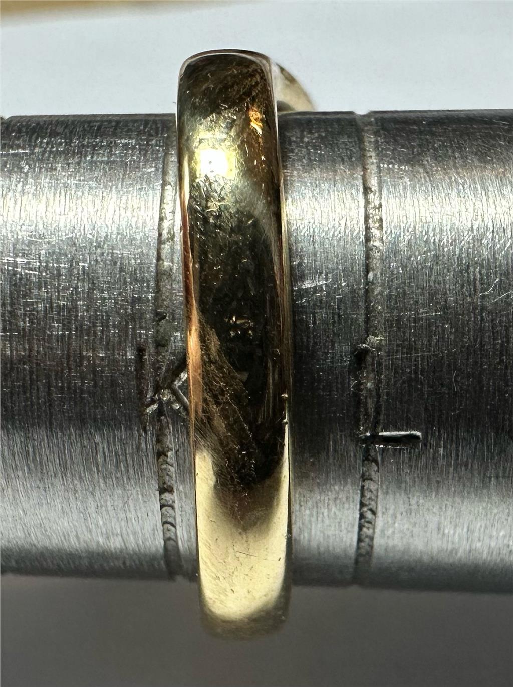 18ct yellow gold diamond ring, size K, featuring a sparkling diamond centerpiece with a polished band.