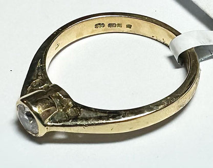 18ct yellow gold diamond ring in size L1/2, showcasing a sparkling diamond set in a classic band design.
