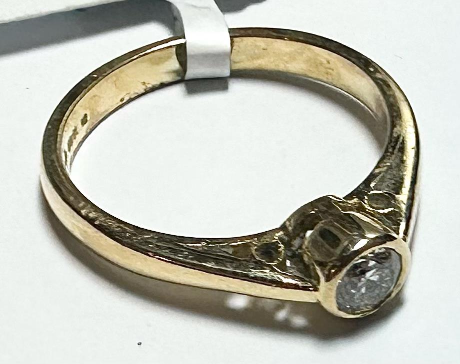 18ct yellow gold diamond ring in size L1/2, showcasing a sparkling diamond set in a classic band style.