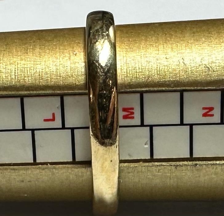 18ct yellow gold diamond ring in size L½ with a sparkling diamond, unbranded, shown from a side view.