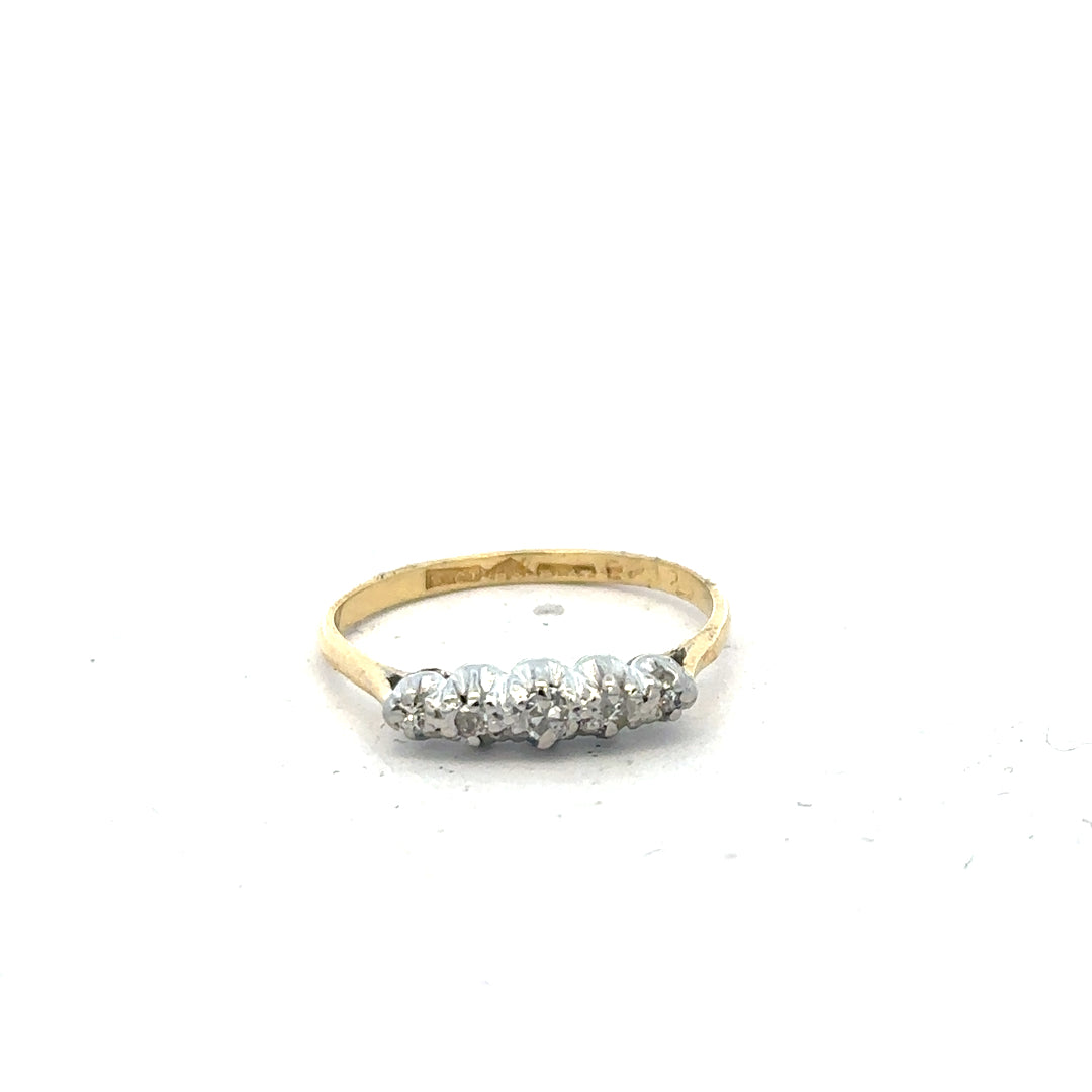 18ct yellow gold diamond ring in size N featuring a sparkling central diamond and intricate band design.