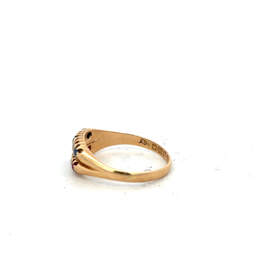 18ct yellow gold ring with diamonds, rubies, and sapphires, size P, featuring a luxurious gemstone design.