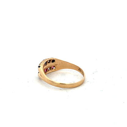 18ct yellow gold ring with diamonds, ruby, and sapphire, size P, featuring intricate gemstone settings and elegant design.