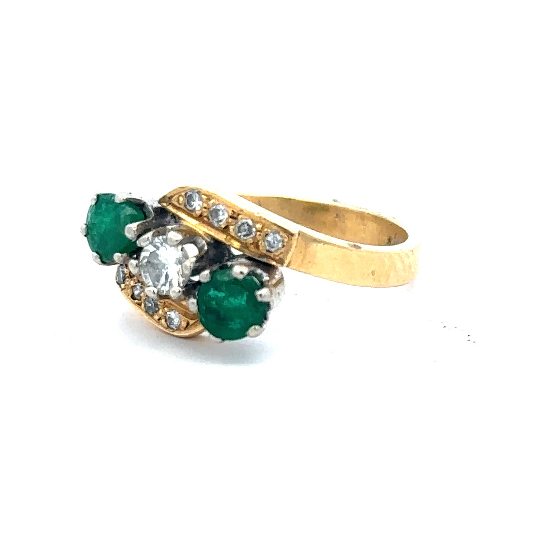 18ct yellow gold emerald and diamond ring, size N, featuring a central emerald surrounded by sparkling diamonds.