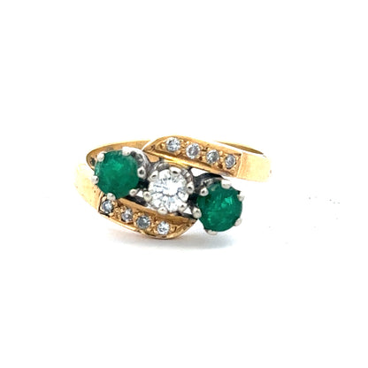 18ct yellow gold emerald and diamond ring, size N, featuring a central emerald gemstone with diamond accents.