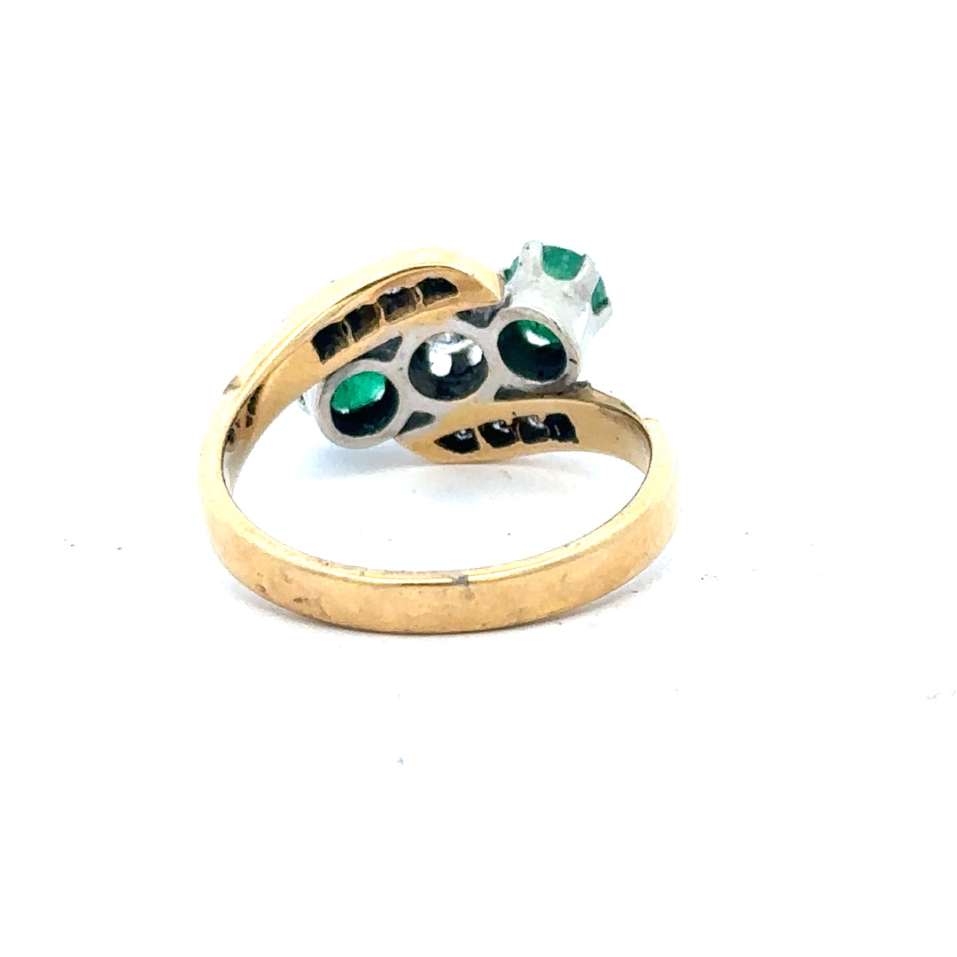 18ct yellow gold emerald and diamond ring, size N, featuring a central emerald surrounded by sparkling diamonds.