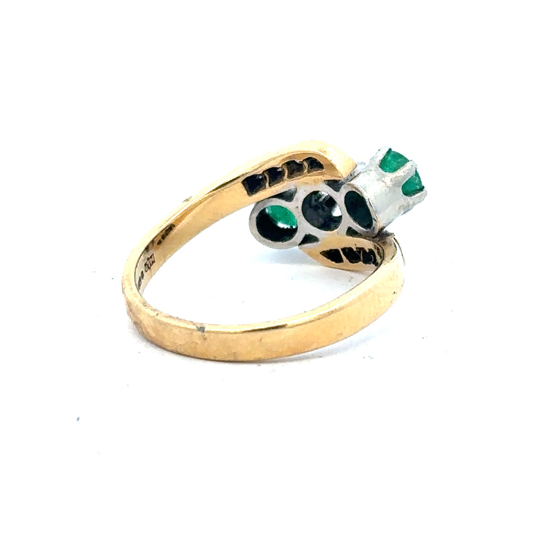 18ct yellow gold emerald and diamond ring, size N, featuring a central emerald surrounded by sparkling diamonds.