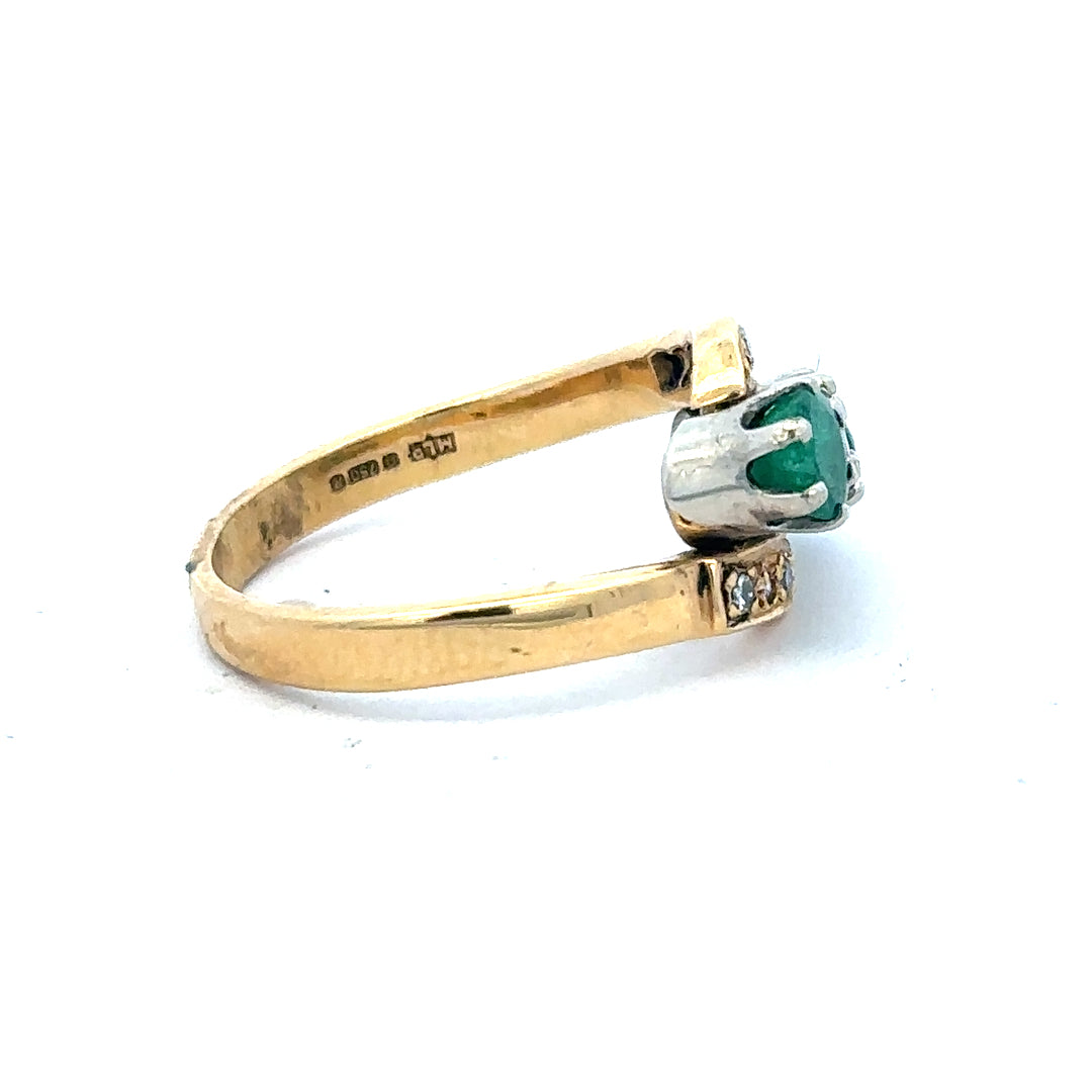 18ct yellow gold emerald and diamond ring, size N, featuring a central emerald gemstone with surrounding diamonds.