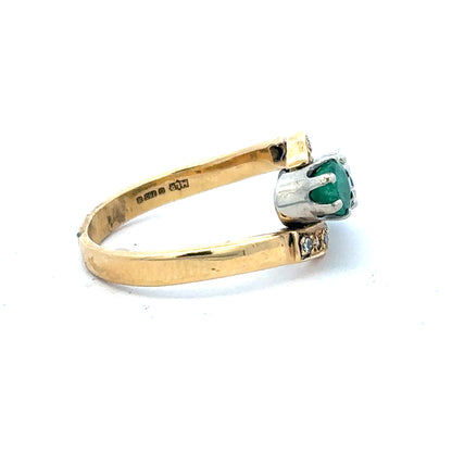 18ct yellow gold emerald and diamond ring, size N, featuring a central emerald gemstone with surrounding diamonds.