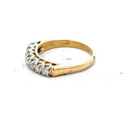 18ct yellow gold half eternity diamond ring with a row of sparkling diamonds encircling the band.