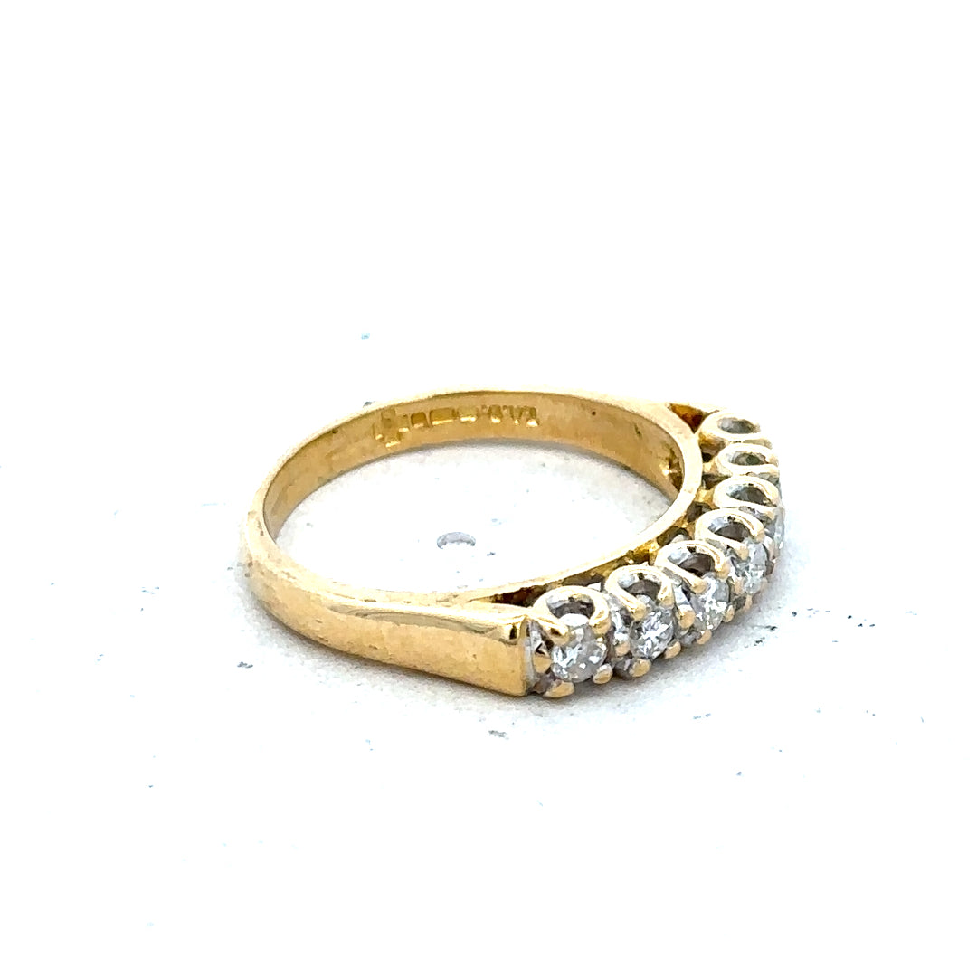 18ct yellow gold half eternity diamond ring with sparkling diamonds set in a sleek band.