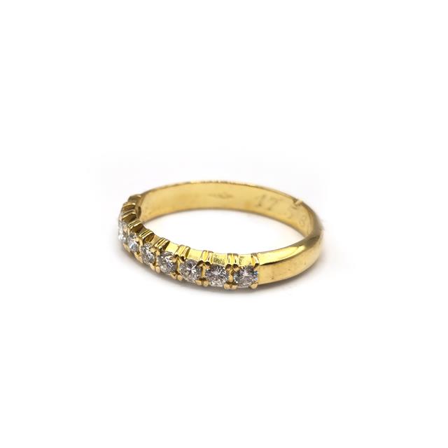 18ct yellow gold half eternity diamond ring with sparkling diamonds, featuring a classic and elegant design.