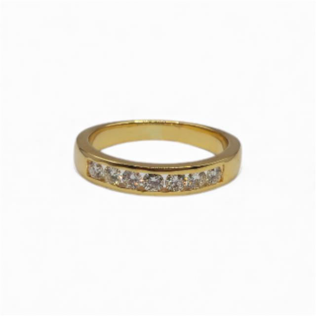 18ct yellow gold half eternity diamond ring with sparkling diamonds, elegant jewelry piece showcasing fine craftsmanship.