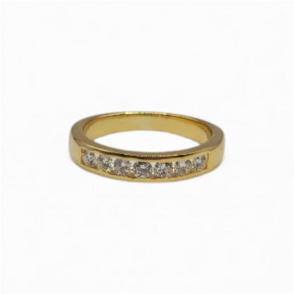 18ct yellow gold half eternity diamond ring with sparkling diamonds, elegant jewelry piece showcasing fine craftsmanship.
