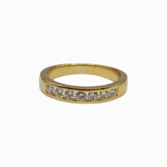18ct yellow gold half eternity diamond ring with sparkling diamonds, elegant jewelry piece showcasing fine craftsmanship.