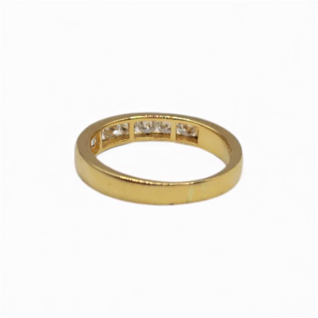 18ct yellow gold half eternity diamond ring with sparkling diamonds, elegant and stylish jewelry piece.