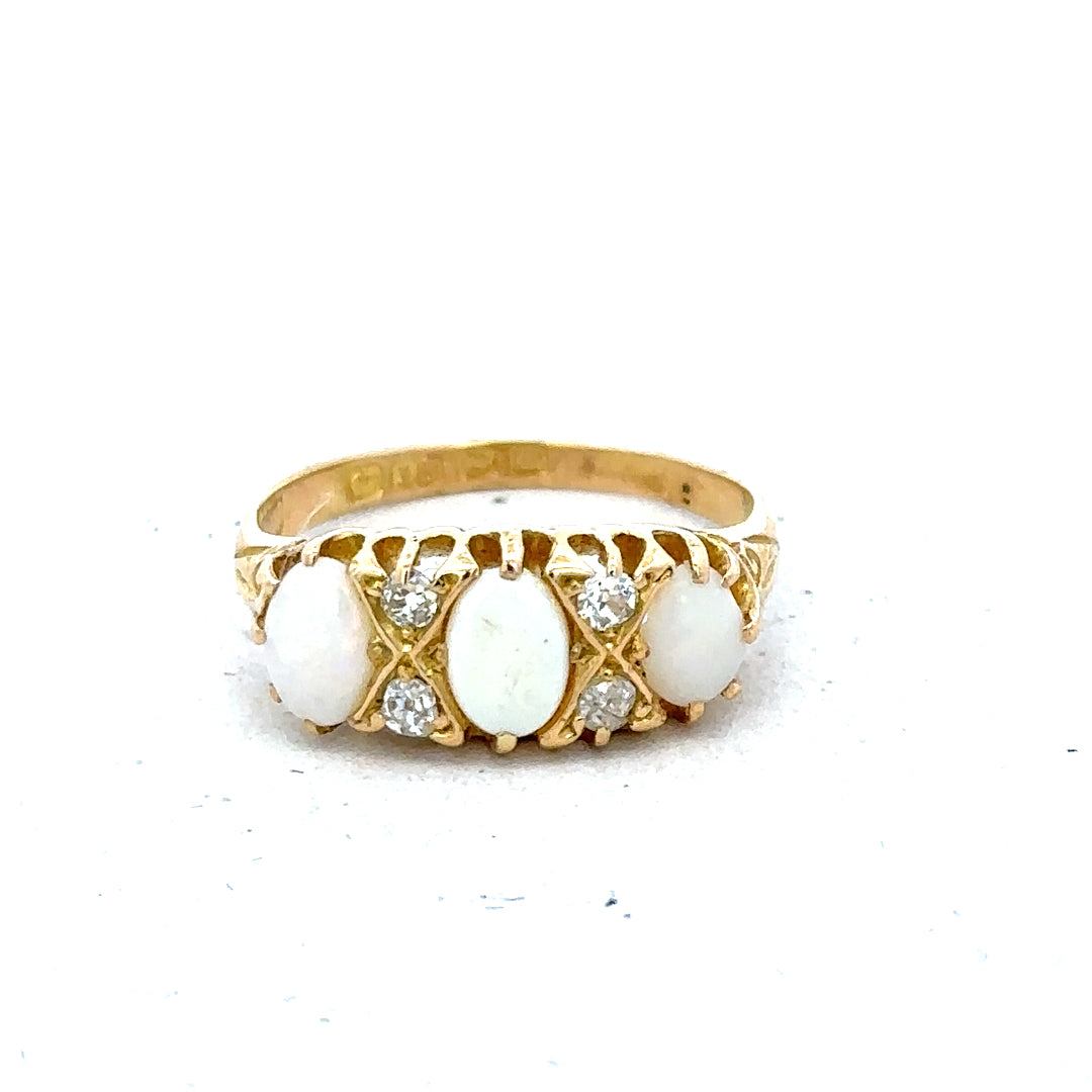 18ct yellow gold opal and diamond ring, size M, featuring a vibrant opal centerpiece with sparkling diamonds.