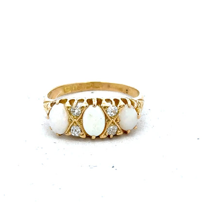 18ct yellow gold opal and diamond ring, size M, featuring a vibrant opal centerpiece with sparkling diamonds.