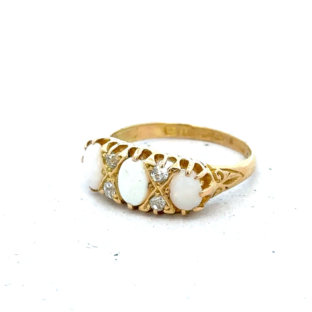 18ct yellow gold opal and diamond ring, size M, featuring a vibrant opal centerpiece and sparkling diamond accents.