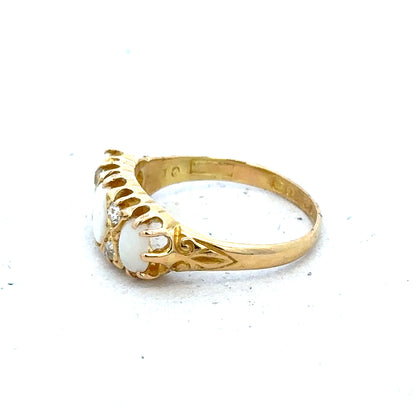 18ct yellow gold opal and diamond ring in size M, featuring a vibrant opal centerpiece and sparkling diamonds.