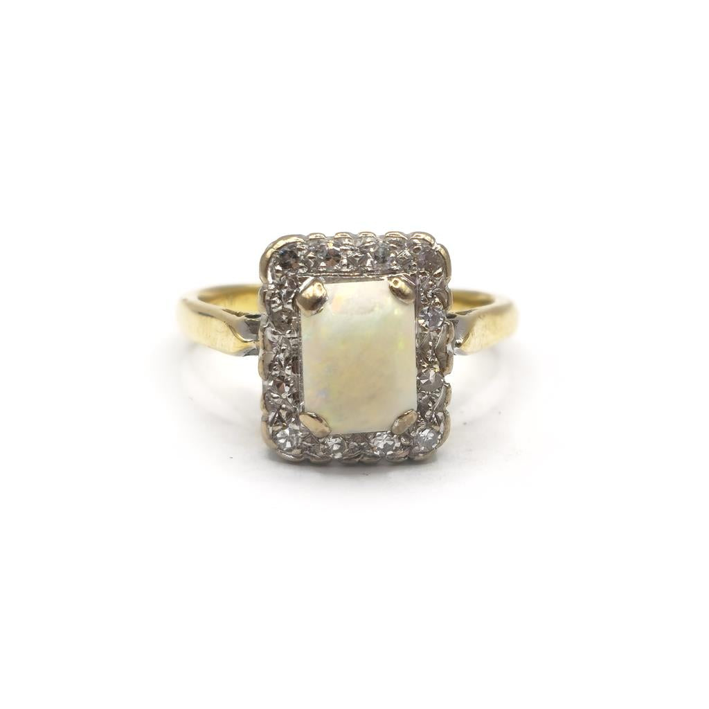 18ct yellow gold opal and diamond ring in size N1/2, featuring a vibrant opal gemstone and sparkling diamonds.