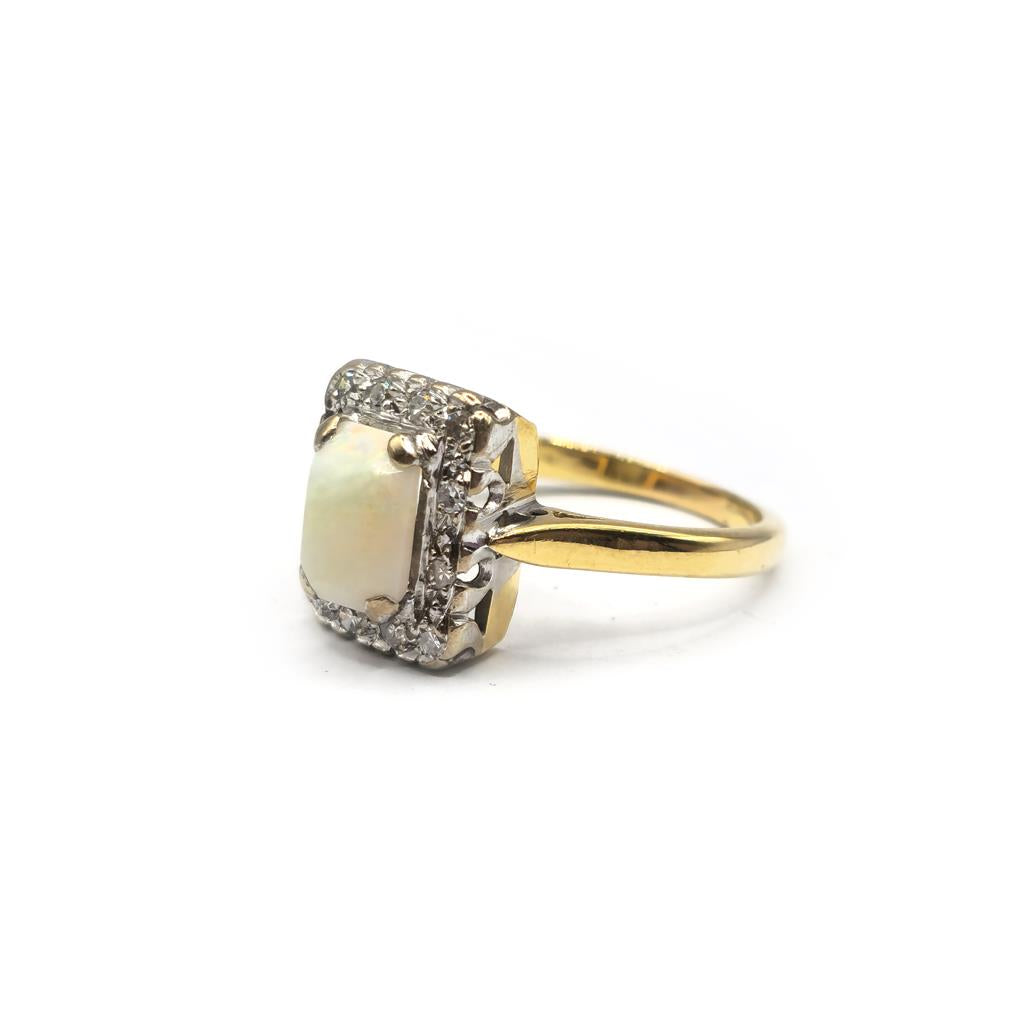 18ct yellow gold opal and diamond ring in size N1/2, featuring a vibrant opal center and sparkling diamonds on a sleek gold band.