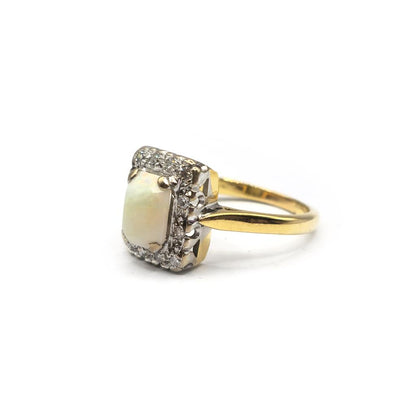 18ct yellow gold opal and diamond ring in size N1/2, featuring a vibrant opal center and sparkling diamonds on a sleek gold band.