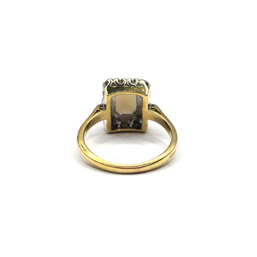 18ct yellow gold opal and diamond ring in size N 1/2, featuring a vibrant opal center with diamond accents.