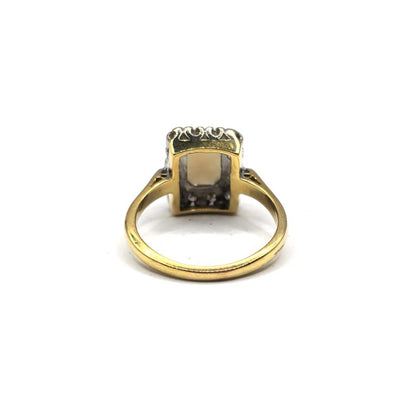 18ct yellow gold opal and diamond ring in size N 1/2, featuring a vibrant opal center with diamond accents.