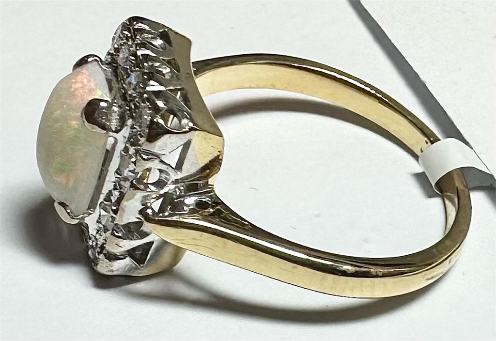 18ct yellow gold opal and diamond ring, size N½, featuring a vibrant opal center with sparkling diamonds, unbranded jewelry piece.