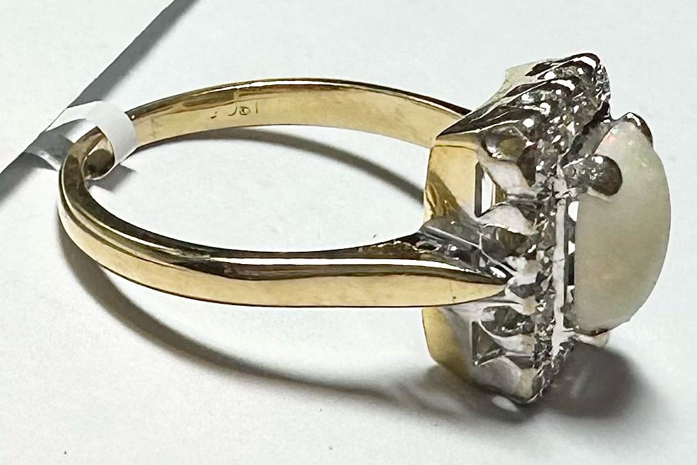 18ct yellow gold opal and diamond ring in size N1/2, featuring an elegant gold band with a vibrant opal and sparkling diamonds.