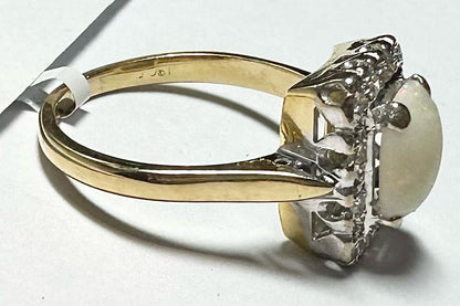 18ct yellow gold opal and diamond ring in size N1/2, featuring an elegant gold band with a vibrant opal and sparkling diamonds.