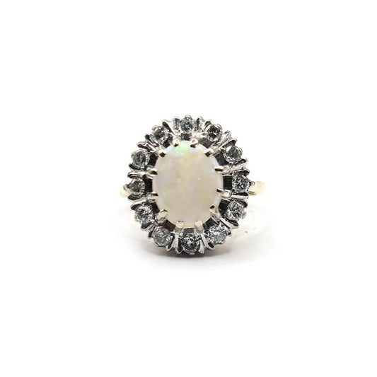 18ct yellow gold oval opal and diamond ring featuring 1.85 carat opal and 0.60 carat diamonds, elegant jewelry piece.