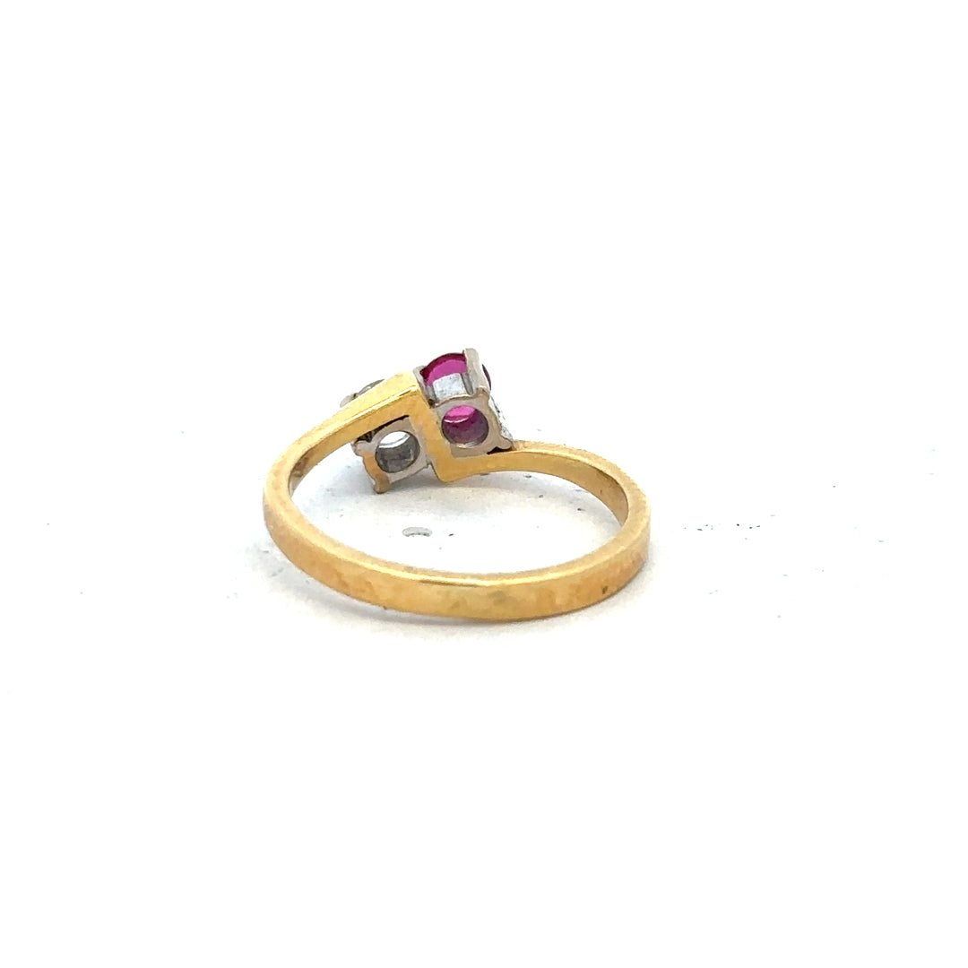 18ct yellow gold ruby and diamond ring, size L, featuring a central ruby gemstone surrounded by sparkling diamonds.