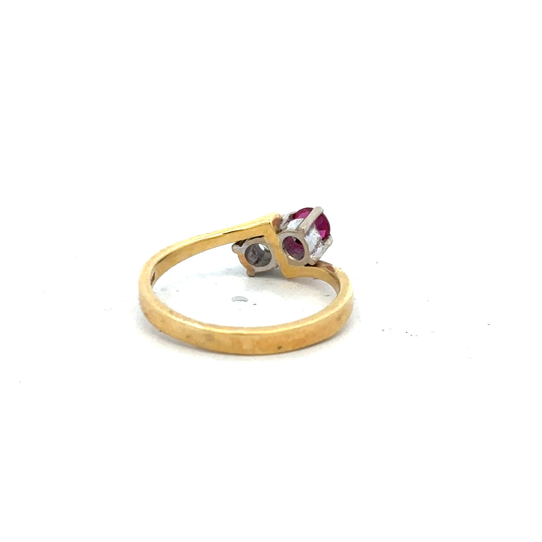 18ct yellow gold ruby and diamond ring in size L, featuring a central ruby with surrounding diamonds, elegant and classic jewelry piece.